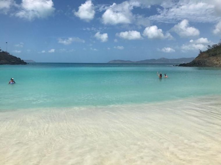 Shallow turquoise water off Sapphire Beach in front of the St. Thomas condo with a full kitchen